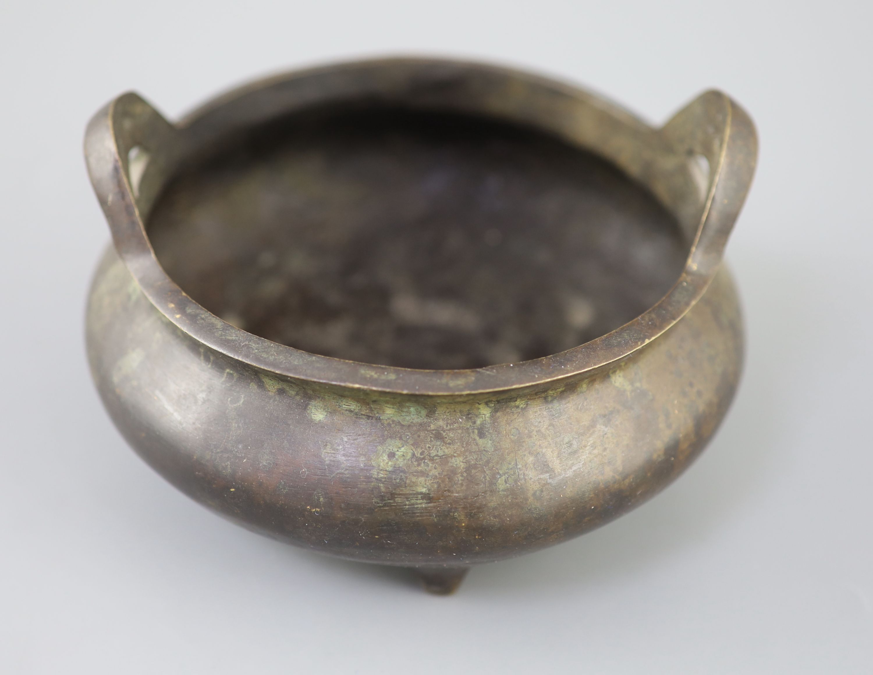 A Chinese bronze tripod censer, Xuande mark but 19th century, 16cm diameter